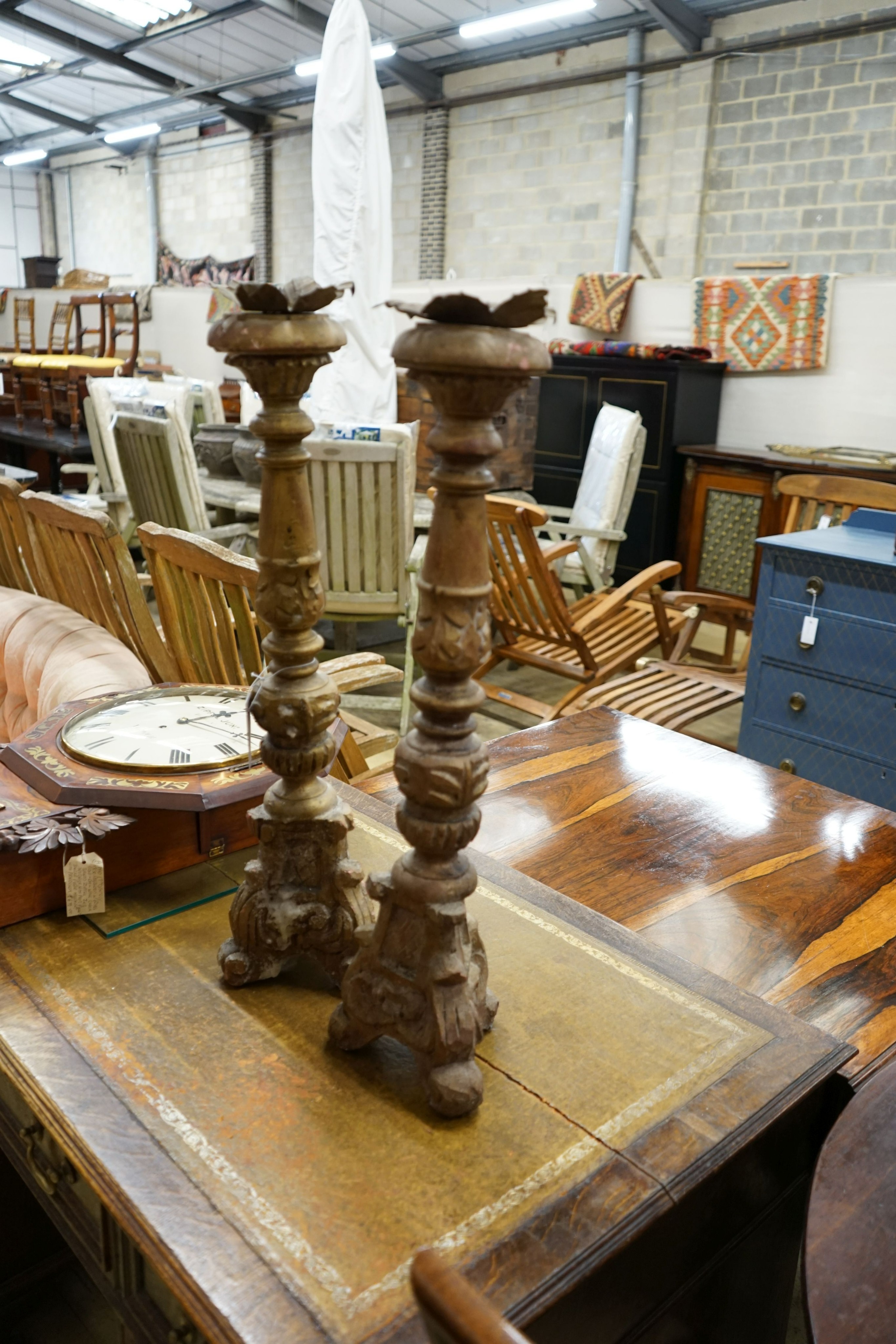 A pair of 18th century style carved giltwood pricket candlesticks, height 70cm